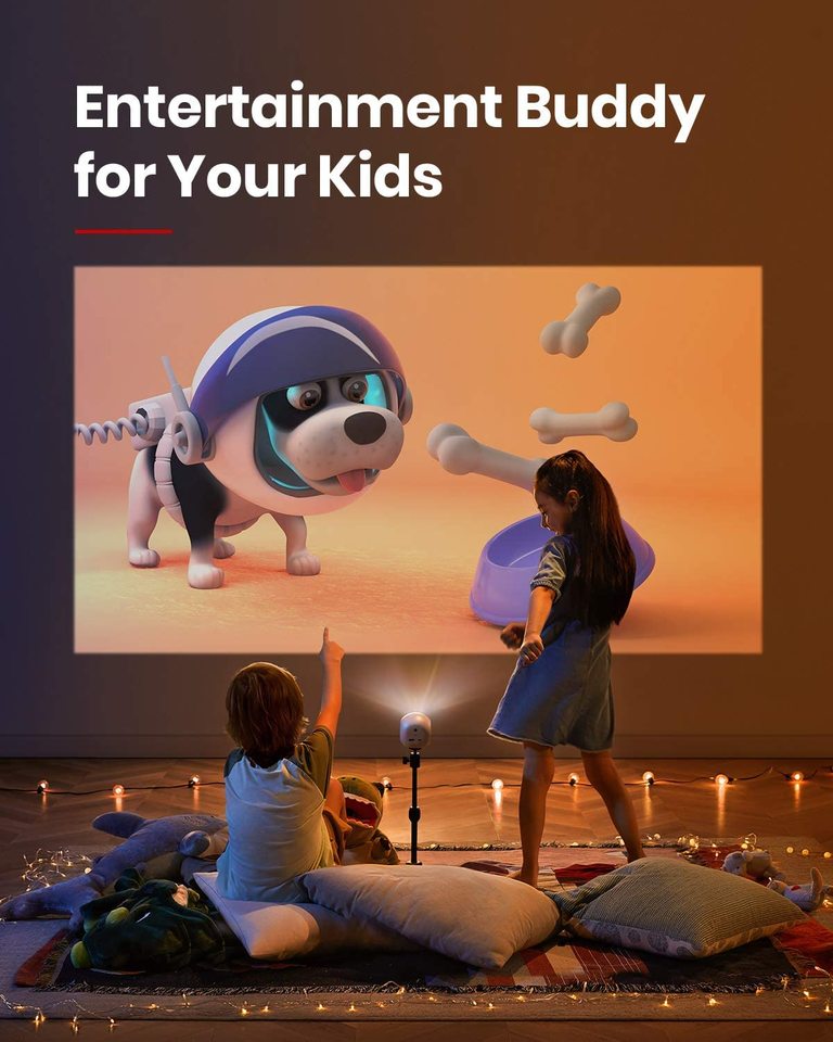 A little boy points and a little girl dances at home while they watch a cartoon with an Astro portable projector.